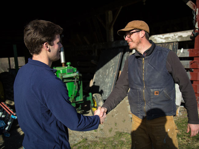 Farm Partners - two farmers shaking hands.