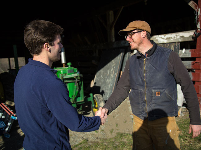 Farm Partners - two farmers shaking hands.